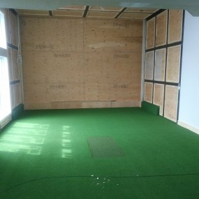 Golf room prepped for wall panels